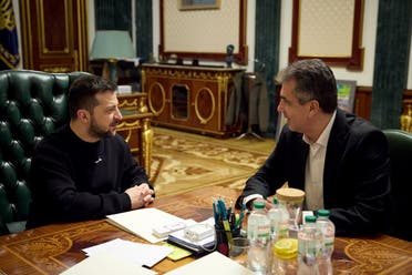 This handout photograph taken and released by the Ukrainian Presidential Press Service on February 16, 2023 shows Ukraine’s President Volodymyr Zelenskyy (L) meeting with Israel’s Foreign Minister Eli Cohen (R) in Kyiv. (AFP)