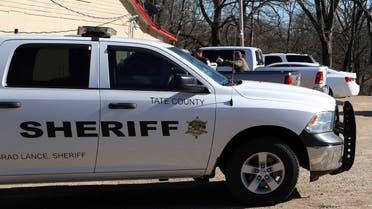 A vehicle of the Tate County Sheriff is seen parked outside a gas station convenience store after a shooting, in Arkabutla, Mississippi, U.S. February 17, 2023. (Reuters)