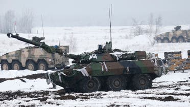 A French armoured reconnaissance tanks AMX 10 RC (front) and German Boxer armoured personnel carriers take position during the German-French armed forces exercise Feldberg 2013 (Hillfield 2013) at the military training area Oberlausitz, near the village of Weisskessel, about 50 miles south-east of Berlin, March 19, 2013. REUTERS/Fabrizio Bensch (GERMANY - Tags: MILITARY)