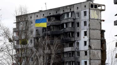 A Ukrainian national flag flies in front of a destroyed residential building amid Russia's invasion of Ukraine, in Borodianka, Kyiv region, Ukraine, February 18, 2023. (Reuters)