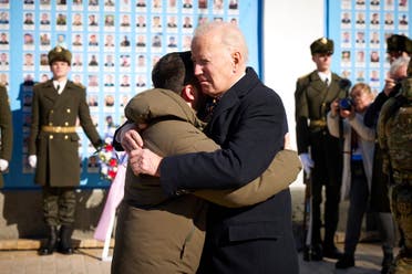 President Joe Biden, right, and Ukrainian President Volodymyr Zelenskyy hug as they say goodbye at the Memorial Wall of Fallen Defenders of Ukraine in Russian-Ukrainian War, in Kyiv, Ukraine, Monday, Feb. 20, 2023. (AP)