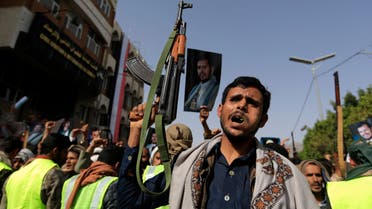 Supporters of Yemen's Houthi rebels brandishing weapons raise portraits of their leader Abdul Malik Al-Houthi during a rally in the capital Sanaa on June 3, 2022, a day after the country's warring parties agreed to renew a two-month truce. Yemen has been gripped by conflict since the Iran-backed Huthi rebels took control of the capital Sanaa in 2014, triggering a Saudi-led military intervention in support of the beleaguered government the following year. (Photo by MOHAMMED HUWAIS / AFP)