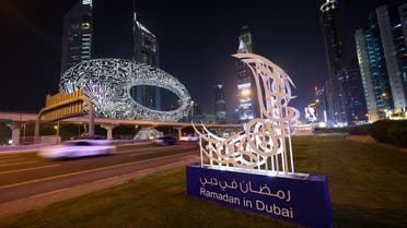 A traditional crescent moon decorates a street in front of the Future Museum in Dubai on April 2, 2022, during the first day of the Muslim holy fasting month of Ramadan. (AFP)