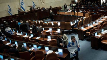 Israel's lawmaker Yair Lapid, walks in the Israel's parliament, the Knesset, as lawmakers convene for a vote on a contentious plan to overhaul the country's legal system, in Jerusalem, February 20, 2023. Maya Alleruzzo/Pool via REUTERS