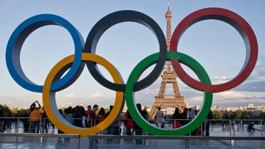 FILE - The Olympic rings are set up at Trocadero plaza that overlooks the Eiffel Tower, a day after the official announcement that the 2024 Summer Olympic Games will be in the French capital, in Paris, France, Thursday, Sept. 14, 2017. The governments of more than 30 nations released a letter Monday, Feb. 20, 2023, calling on the IOC to clarify the definition of “neutrality” as it seeks a way to allow Russian and Belarusian athletes back into international sports and, ultimately, next year's Paris Olympics.(AP Photo//Michel Euler, File)