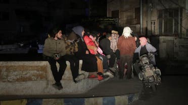 People sit on the street, after the deadly earthquake, in rebel-held Idlib, Syria February 20, 2023. REUTERS/Khalil Ashawi