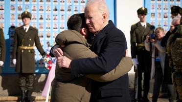 U.S. President Joe Biden embraces Ukraine's President Volodymyr Zelenskiy as they visit the Wall of Remembrance to pay tribute to killed Ukrainian soldiers, amid Russia's attack on Ukraine, in Kyiv, Ukraine February 20, 2023. Ukrainian Presidential Press Service/Handout via REUTERS ATTENTION EDITORS - THIS IMAGE HAS BEEN SUPPLIED BY A THIRD PARTY.