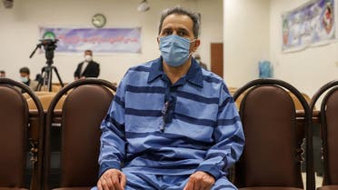 Jamshid Sharmahd, who is accused by the Iranian government of being a leader of the US-based “Tondar terrorist group” behind a deadly attack in Iran in 2008, attends the first hearing of his trial in the capital Tehran on February 6, 2022. (AFP)