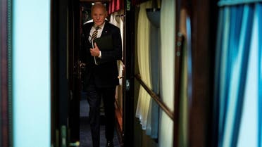 President Joe Biden walks down a corridor to his cabin on a train after a surprise visit with Ukrainian President Volodymyr Zelenskyy, Monday, Feb. 20, 2023, in Kyiv.   