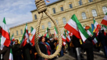 A noose is seen as people hold Iranian flags during a protest on the day of the Munich Security Conference, in Munich, Germany February 17, 2023. (Reuters)