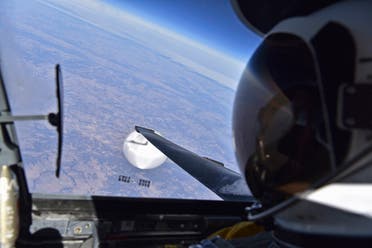 In this handout image provided by the Department of Defense, a US Air Force U-2 pilot looks down at the suspected Chinese surveillance balloon on February 3, 2023 as it hovers over the Central Continental United States. (AFP)