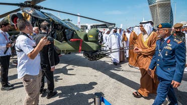 UAE Deputy Prime Minister Sheikh Mansour bin Zayed al-Nahyan (2nd-R) views a TAI/AgustaWestland T129 ATAK attack helicopter on display at the Turkish Aerospace stand during the Naval Defence and Maritime Security Exhibition (NAVDEX), part of the wider International Defence Exhibtion (IDEX) at the Abu Dhabi International Exhibition Centre on February 20, 2023. (AFP)