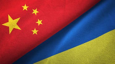 Ukraine and China two flags together realations textile cloth fabric texture stock photo