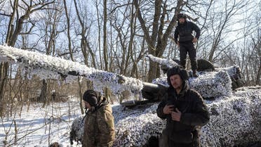  Ukrainian servicemen of the 17th Independent Tanks Brigade are seen in front of a T-64 tank, as Russia’s attack on Ukraine continues, near the frontline town of Bakhmut, Donetsk region, Ukraine, on February 23, 2023. (Reuters)