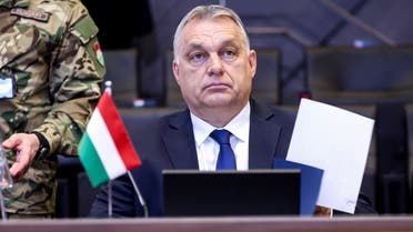Hungary’s Prime Minister Viktor Orban attends a NATO video summit on Russia’s invasion of the Ukraine at the NATO headquarters in Brussels on February 25, 2022. (AFP)