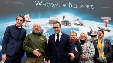 Patrice Caine, Chairman and CEO of Thales Group, Ukrainian Defence Minister Oleksii Reznikov, French Defence Minister Sebastien Lecornu, Mayor of Limours Chantal Thiriet, and officials pose before a visit at the Thales radar factory in Limours, France, on February 1, 2023. (Reuters)