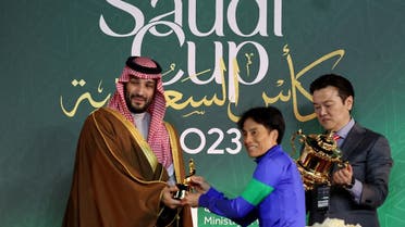 Saudi Arabia's crown prince Mohammed bin Salman, presenting jockey Yutaka Yoshida on Panthalassa  and owner Naoki Yoneyama after winning the Saudi Cup on February 25, - King Abdulaziz Racetrack, Riyadh, Saudi Arabia. (Reuters)