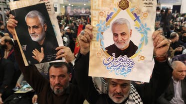 Iranians carry the portrait of slain Iranian commander Qasem Soleimani during a ceremony in the capital Tehran, on January 3, 2023, to commemorate the third anniversary of the killing of Soleimani and Iraqi commander Abu Mahdi al-Muhandis by a US drone strike in the Iraqi capital. (AFP)