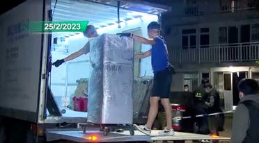 Police loads the refrigerator that is suspected of having been used to keep body parts of 28-year-old model Abby Choi, onto a truck in Hong Kong, China, February 25, 2023 in this screen grab taken from a handout video. (Reuters)