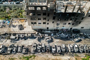This picture taken on February 27, 2023 shows an aerial view of a scrapyard where cars were torched overnight, in the Palestinian town of Huwara near Nablus in the occupied West Bank. (AFP)