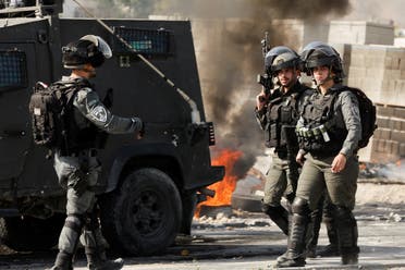 Members of the Israeli troops walk as they clash with Palestinians during a raid in Jericho in the Israeli-occupied West Bank, March 1, 2023. (Reuters)