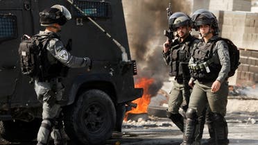 Members of the Israeli troops walk as they clash with Palestinians during a raid in Jericho in the Israeli-occupied West Bank, March 1, 2023. (Reuters)