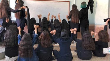 Schiolgirlsex - Iranian schoolgirls 'forced to watch porn' to dissuade protests: Report |  Al Arabiya English