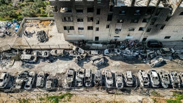 This picture taken on February 27, 2023 shows an aerial view of a scrapyard where cars were torched overnight, in the Palestinian town of Huwara near Nablus in the occupied West Bank. (AFP)