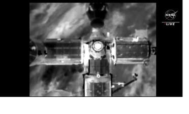 A screenshot of the Dragon capsule shortly before landing at the International Space Station (ISS)