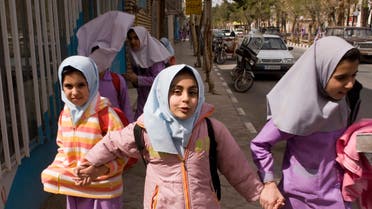 School girls walk down the street in Iranian President Mahmoud Ahmadinejad's birth village of Aradan, east of Tehran, March 12, 2008. (File photo: Reuters)