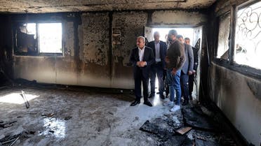 Palestinian Prime Minister Mohammad Shtayyeh (L) checks damaged Palestinian property as he visits Huwara town in the occupied West Bank, on March 1, 2023, following deadly violence by Israeli settlers. (AFP)