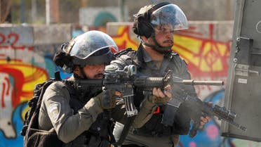 Israeli border police officers take up position during clashes with Palestinians amid a raid in Jericho in the Israeli-occupied West Bank, March 1, 2023. (Reuters)