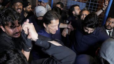 Pakistan's former Prime Minister, Imran Khan, along with his supporters walks as he leaves the district High Court in Lahore, Pakistan February 20, 2023. (Reuters)