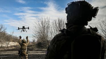 A Ukrainian serviceman flies a drone to spot Russian positions near the city of Bakhmut, in the region of Donbas, on March 5, 2023. (Photo by Aris Messinis / AFP)
