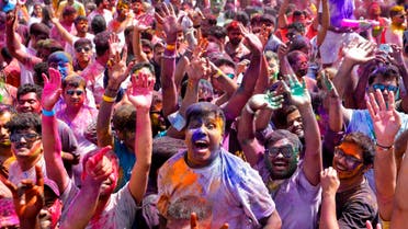 People celebrate Holi, the Hindu festival of colors, in Dubai, United Arab Emirates, Sunday, March 20, 2022. (AP)