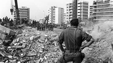 A French soldier watches 25 October 1983 in Beirut the rubble of the -Drakkar- building which was destroyed by a suicide truck bomber overnight, 23 October 1983. Fifty-eight French soldiers and five Lebaneses were killed in the attack. (AFP)