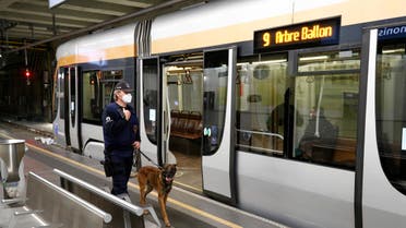 PREVIEW A police officer with a dog patrols at a metro station on the first day of the easing of lockdown measures during the outbreak of the coronavirus disease (COVID-19) in Brussels, Belgium May 4, 2020. (Reuters)