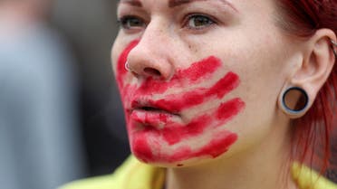 An activist attends a rally to support women's rights on International Women's Day in Almaty, Kazakhstan, March 8, 2023. (Reuters)