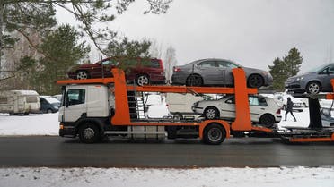A general view of a trailer loaded with vehicles to send to Ukraine, which were confiscated from drunk drivers, in Riga, Latvia March 8, 2023. (Reuters)
