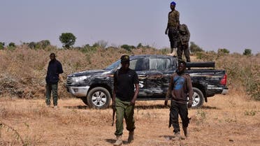 Nigerian security forces are seen on the site of a sabotage attack allegedly perpetrated by Boko Haram against electrical infrastructures on the outskirts of Maiduguri on February 12, 2021. (AFP)