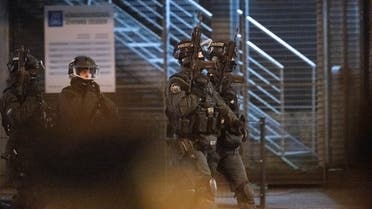 Armed police patrol outside a Jehovah's Witnesses church where several people have been killed in a shooting in Hamburg, northern Germany, on late March 9, 2023. (AFP)