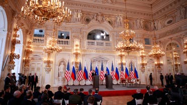 U.S. President Barack Obama (L, on stage) and Russian President Dmitry Medvedev speak at a news conference after they signed the new Strategic Arms Reduction Treaty (START II) at the Prague Castle April 8, 2010. REUTERS/Jason Reed (CZECH REPUBLIC - Tags: POLITICS MILITARY)