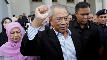 Former Malaysian Prime Minister Muhyiddin Yassin gestures outside Kuala Lumpur Court Complex in Kuala Lumpur, Malaysia March 10, 2023. (Reuters)