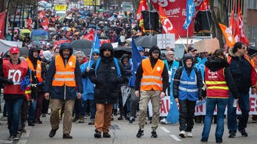 Protesters march through the streets of Toulouse, southwestern France, during a demonstration as part of a nationwide day of strikes and protests called by unions over the proposed pensions overhaul on March 11, 2023. (AFP)
