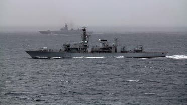 HMS Portland in the foreground and the Russian frigate in the background. (British Royal Navy)