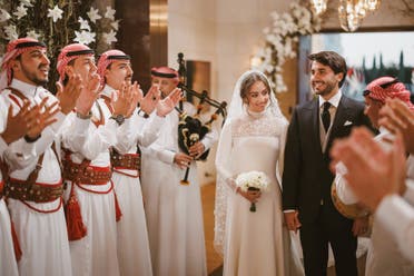 A handout picture released by Jordan's Royal Palace shows the wedding ceremony of the Jordanian monarch's eldest daughter Princess Iman and Jameel Alexander Thermiotis in Amman on March 12, 2023. (AFP)