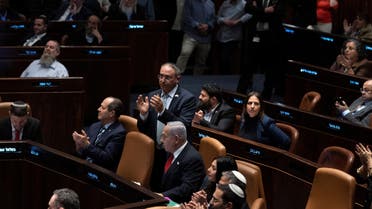 Israeli Prime Minister Benjamin Netanyahu is surrounded by lawmakers at Israel’s parliament, the Knesset, during a vote on acontentious plan to overhaul the country’s legal system, in Jerusalem, Feb. 21, 2023. (Reuters)