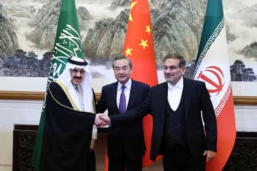 Wang Yi, a member of the Political Bureau of the Communist Party of China (CPC) Central Committee and director of the Office of the Central Foreign Affairs Commission, Ali Shamkhani, the secretary of Iran’s Supreme National Security Council, and Minister of State and national security adviser of Saudi Arabia Musaad bin Mohammed Al Aiban pose for pictures during a meeting in Beijing, China March 10, 2023. (Reuters)