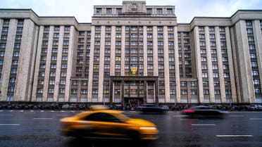 Cars pass in front of the State Duma building, Russia’s lower house of parliament, in Moscow on October 3, 2022. (AFP)