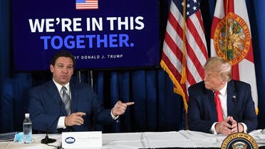 US President Donald Trump (R) and Florida's governor Ron DeSantis hold a COVID-19 and storm preparedness roundtable in Belleair, Florida, July 31, 2020. (AFP)